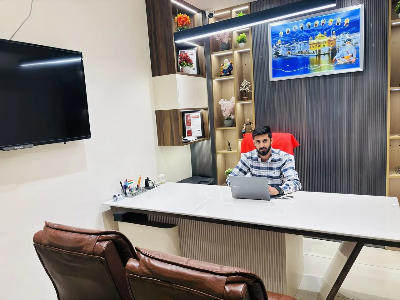 Karandeep Singh, Director of Visa Connection, at his desk